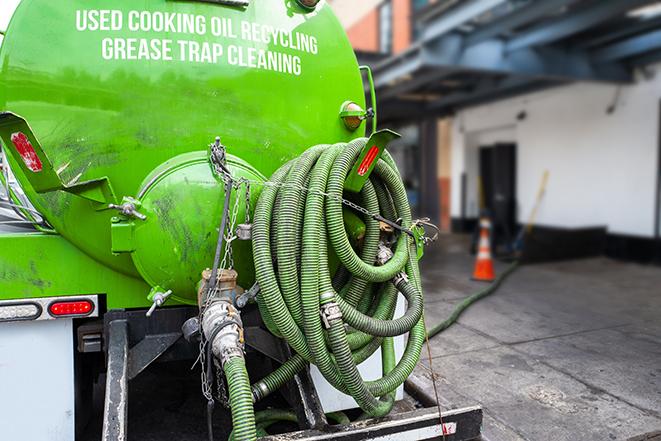 a grease trap being pumped out by a professional service in Maple Shade